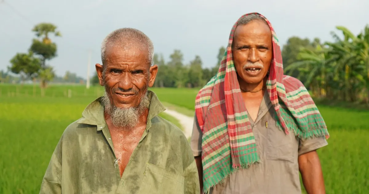 A South Asian elder recounting a family memory while her story is gently captured