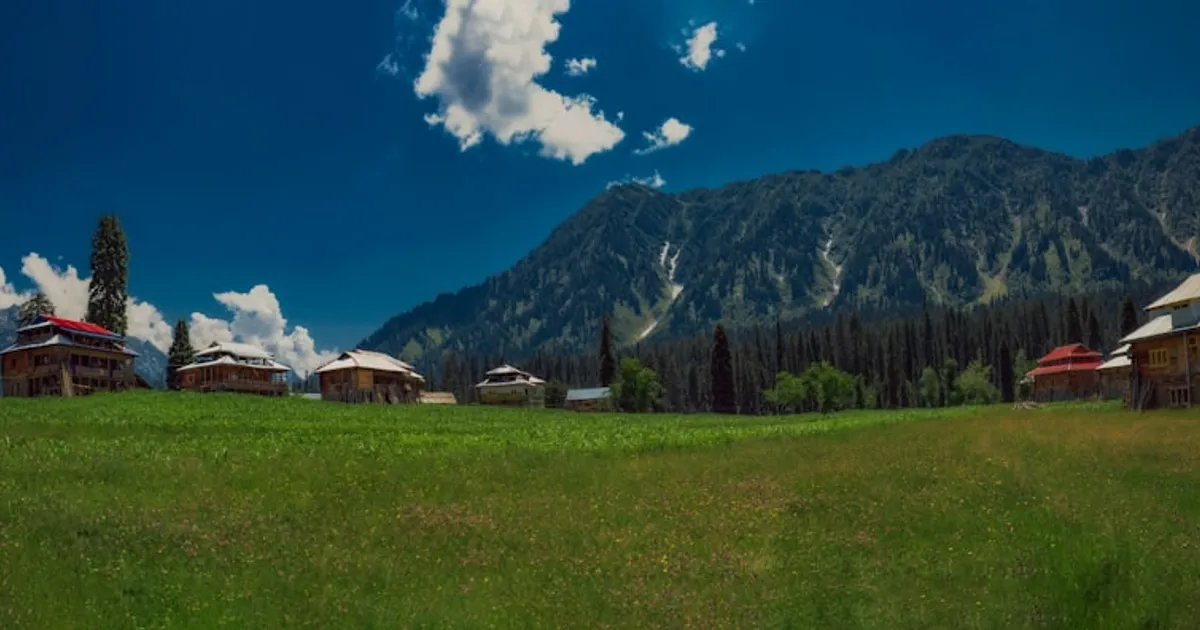 A quiet rural South Asian village with traditional homes and elders gathered, representing the ancestral village where a family's story begins